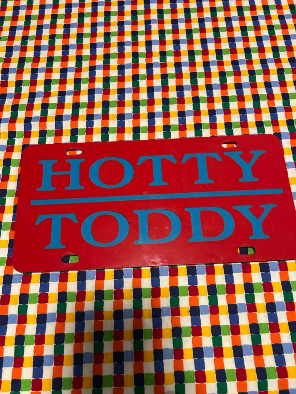 HOTTY TODDY Red License Plate Sign with Blue Lettering